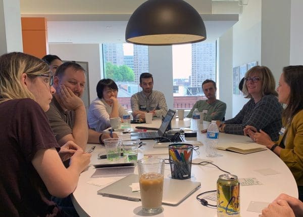 Group of Co-Workers Discussing at Conference Table