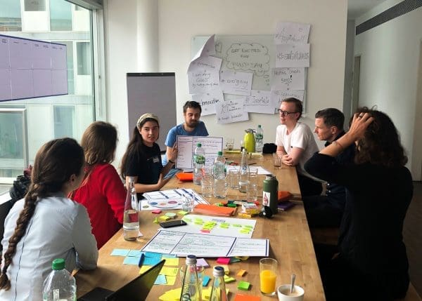Group of Co-Workers Problem Solving in Office